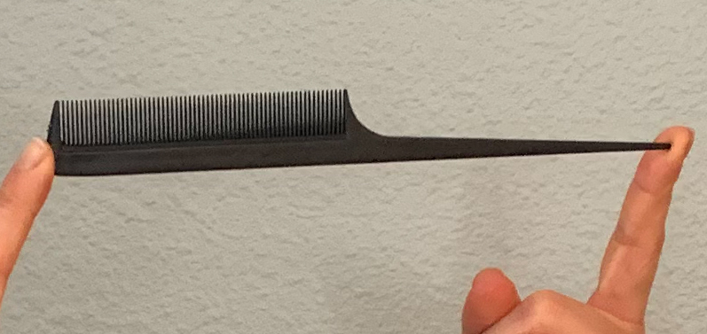 Black fine toothed comb with a tapered handle