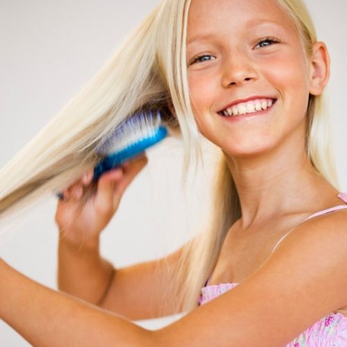 blond brushing her hair