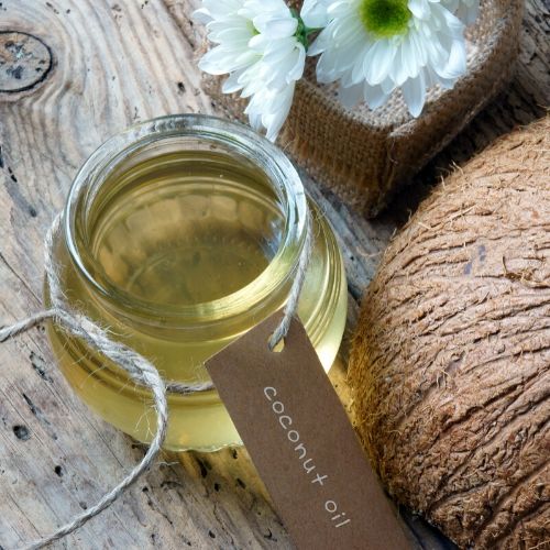 jar of fractionated coconut oil, presumably for lice treatment