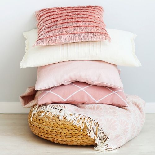 a stack of pillows presumably infested with head lice