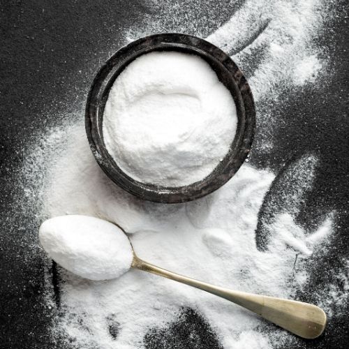 bowl of baking soda, presumably to be used for lice