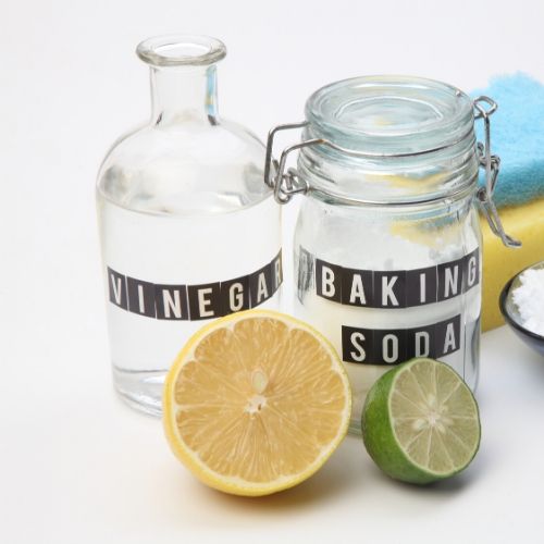 jar of vinegar and baking soda lemon and lime presumably to be used for treating lice