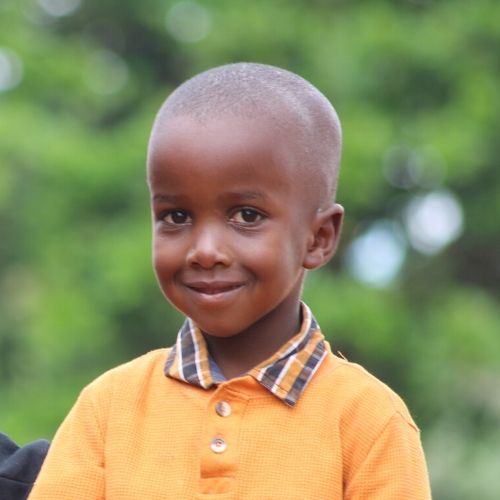 african boy with shaved head, presumably shaved head is for lice treatment