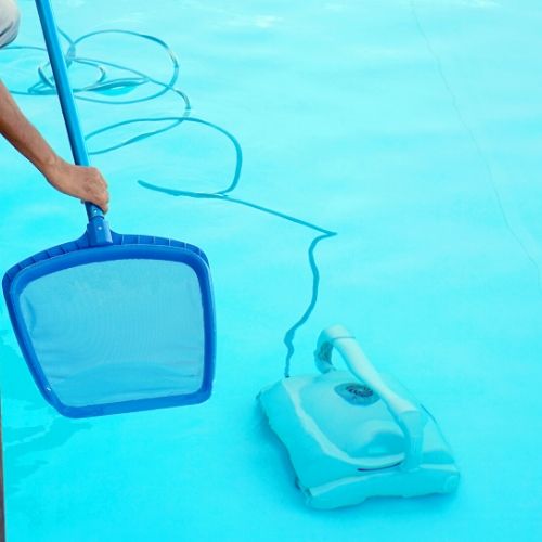 a net cleaning a swimming pool, presumably the pool has head lice in it.