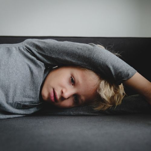 A child lying on the couch