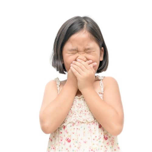 girl holding her nose presumably related to the smell of neem oil lice treatment