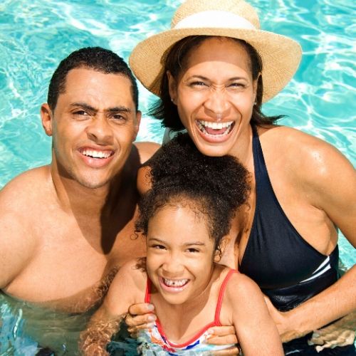 family in swimming pool attempting to avoid getting lice