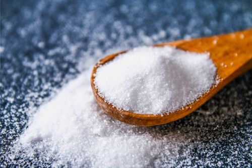 salt on a wooden spoon