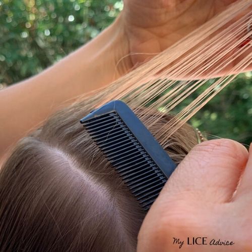 Blond hair being moved to the other side in sections