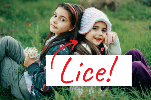 two girls sitting back to back, a way that lice is spread