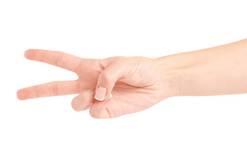 female hand holding 2 fingers