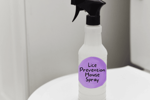 clear bottle labeled lice prevention house spray