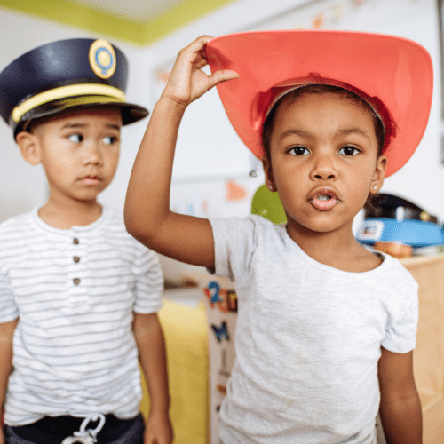 kids putting on hats presumably with head lice